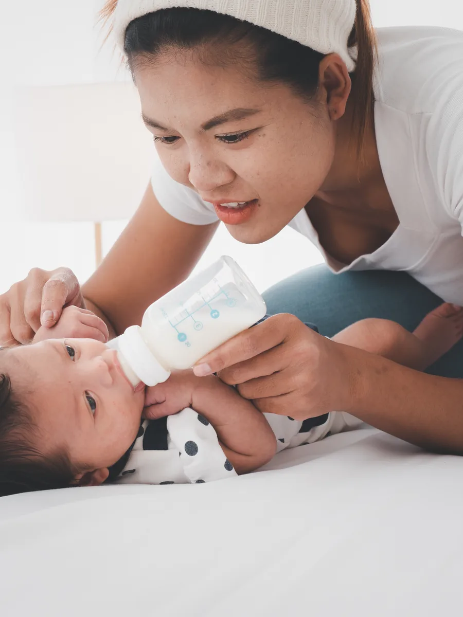 Parent choosing baby-care products in a China retail setting